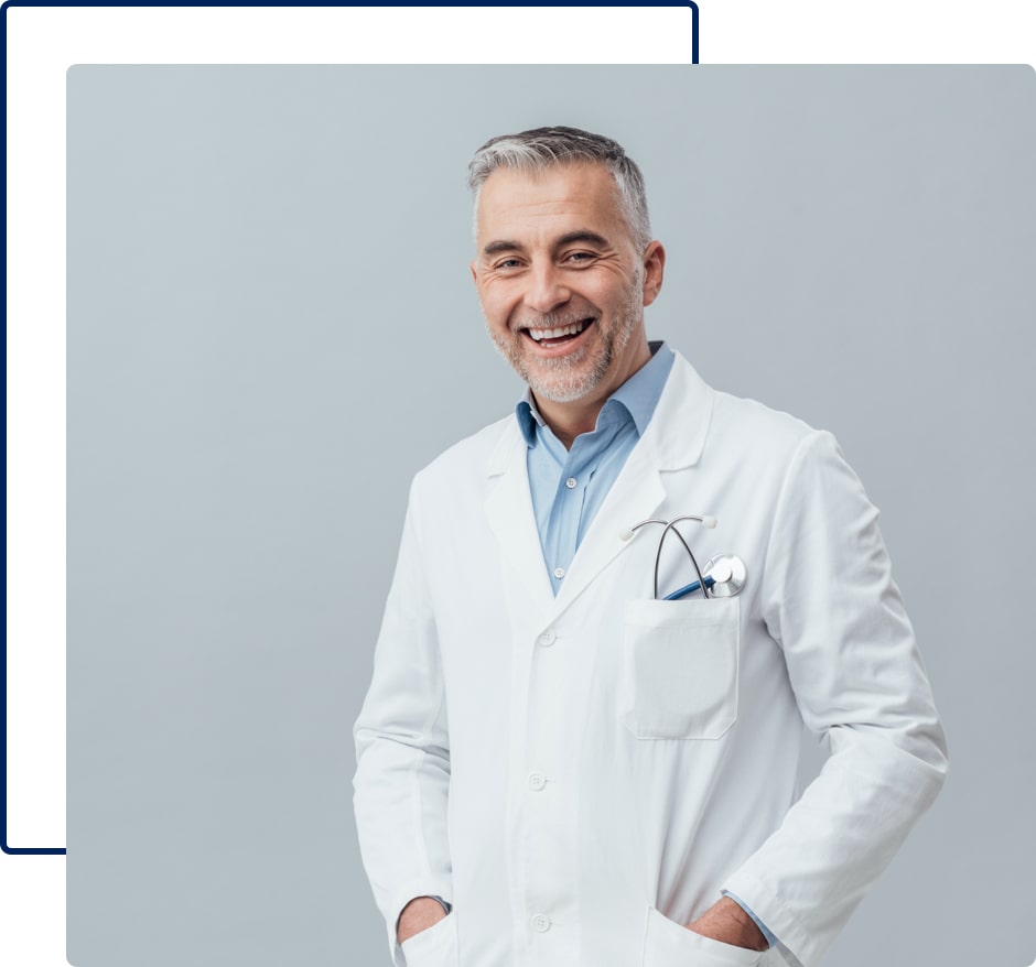 A portrait of a happy doctor with his hands in pockets.